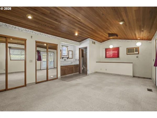 a bathroom with a granite countertop sink mirror and double