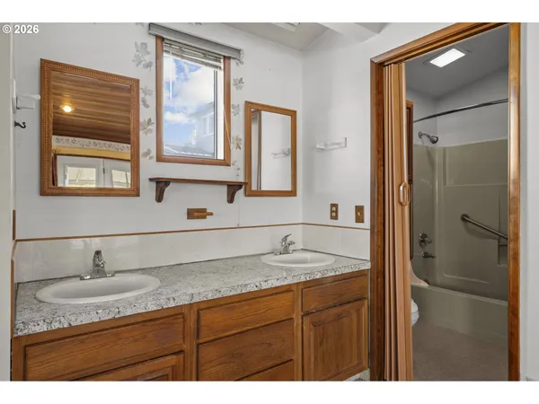 a bathroom with a shower and a sink