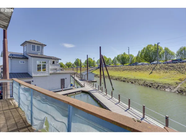 a dinning table and chairs in the patio of a house