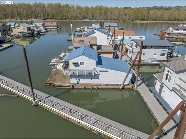 an aerial view of a house with a lake view