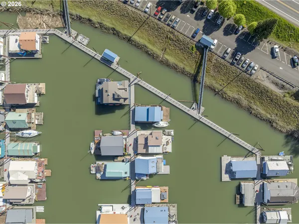 an aerial view of a house with a ocean view