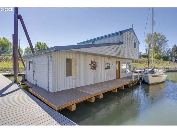a view of a balcony with couch and wooden floor