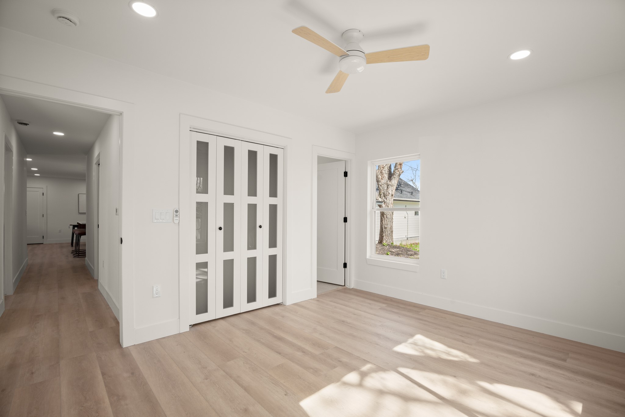 3308 Touchstone Street Austin, TX 78723 - Photo 12 of 38 Empty room featuring recessed lighting, light wood-style flooring, and a ceiling fan