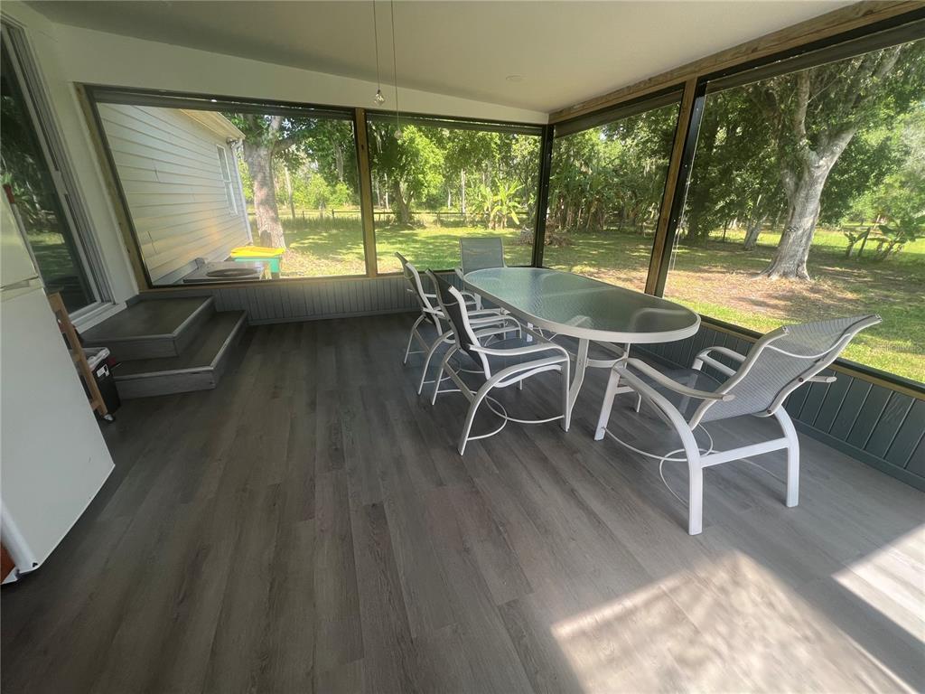 5855 Jack Brack Road St. Cloud, FL 34771 - Photo 30 of 86 a view of a dining room with furniture window and outside view
