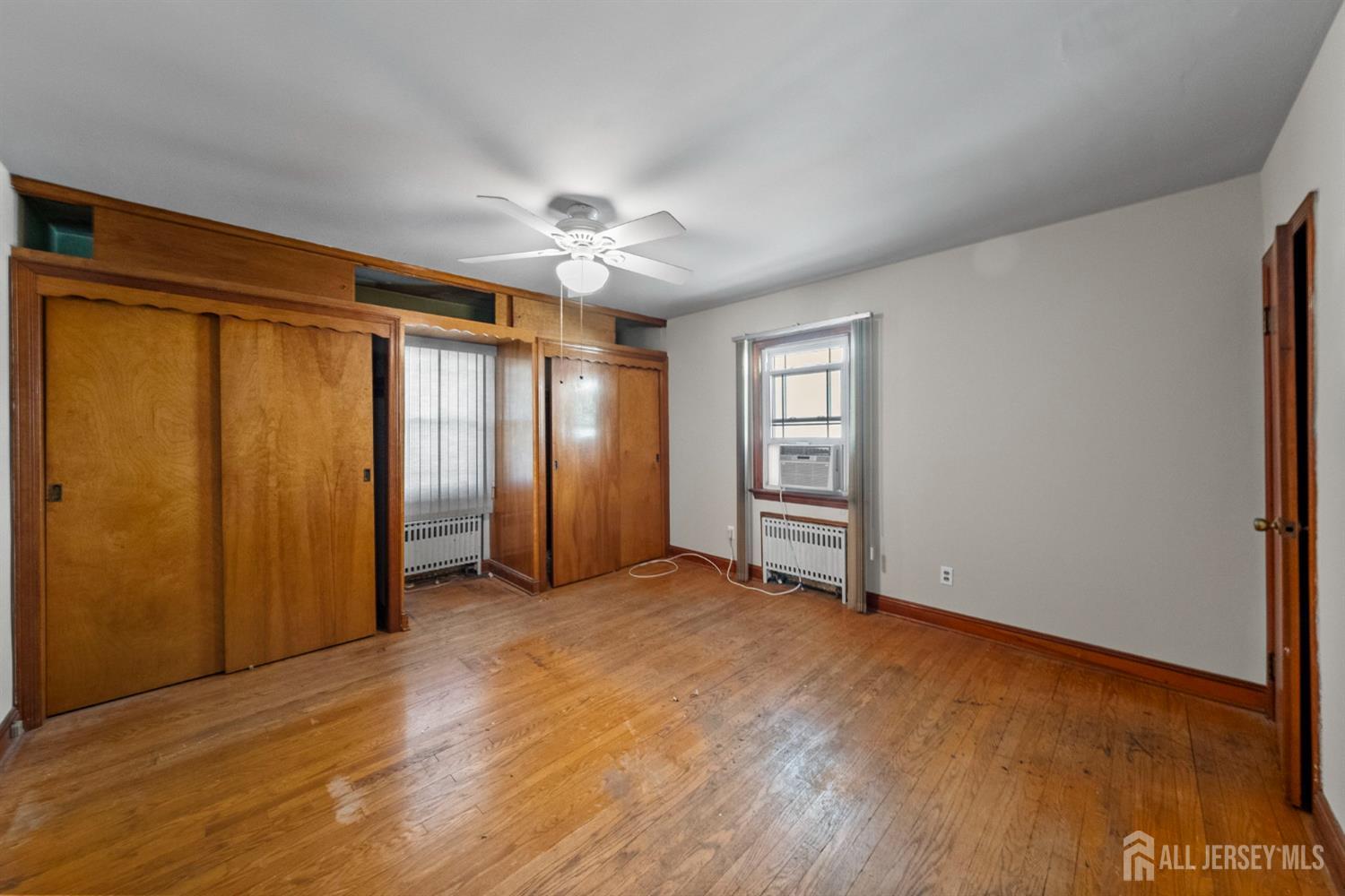 926 Hermann Road North Brunswick, NJ 08902 - Photo 11 of 54 an empty room with windows and closet