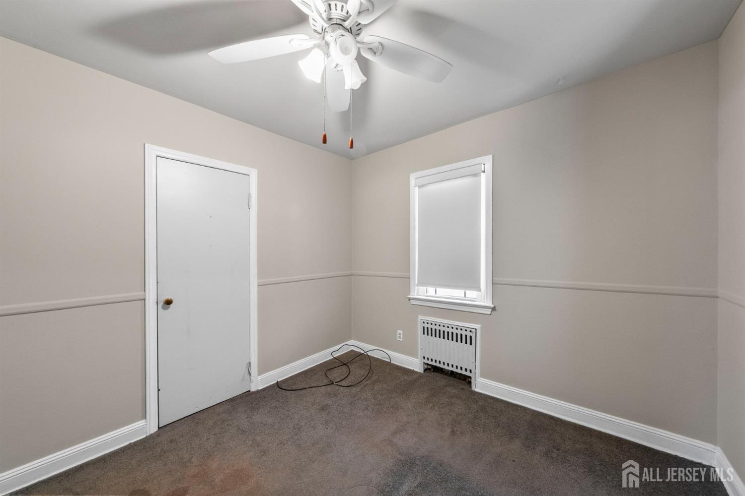 926 Hermann Road North Brunswick, NJ 08902 - Photo 15 of 54 an empty room with windows and fan