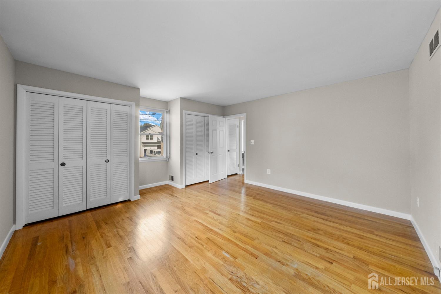 926 Hermann Road North Brunswick, NJ 08902 - Photo 18 of 54 a view of an empty room and wooden floor