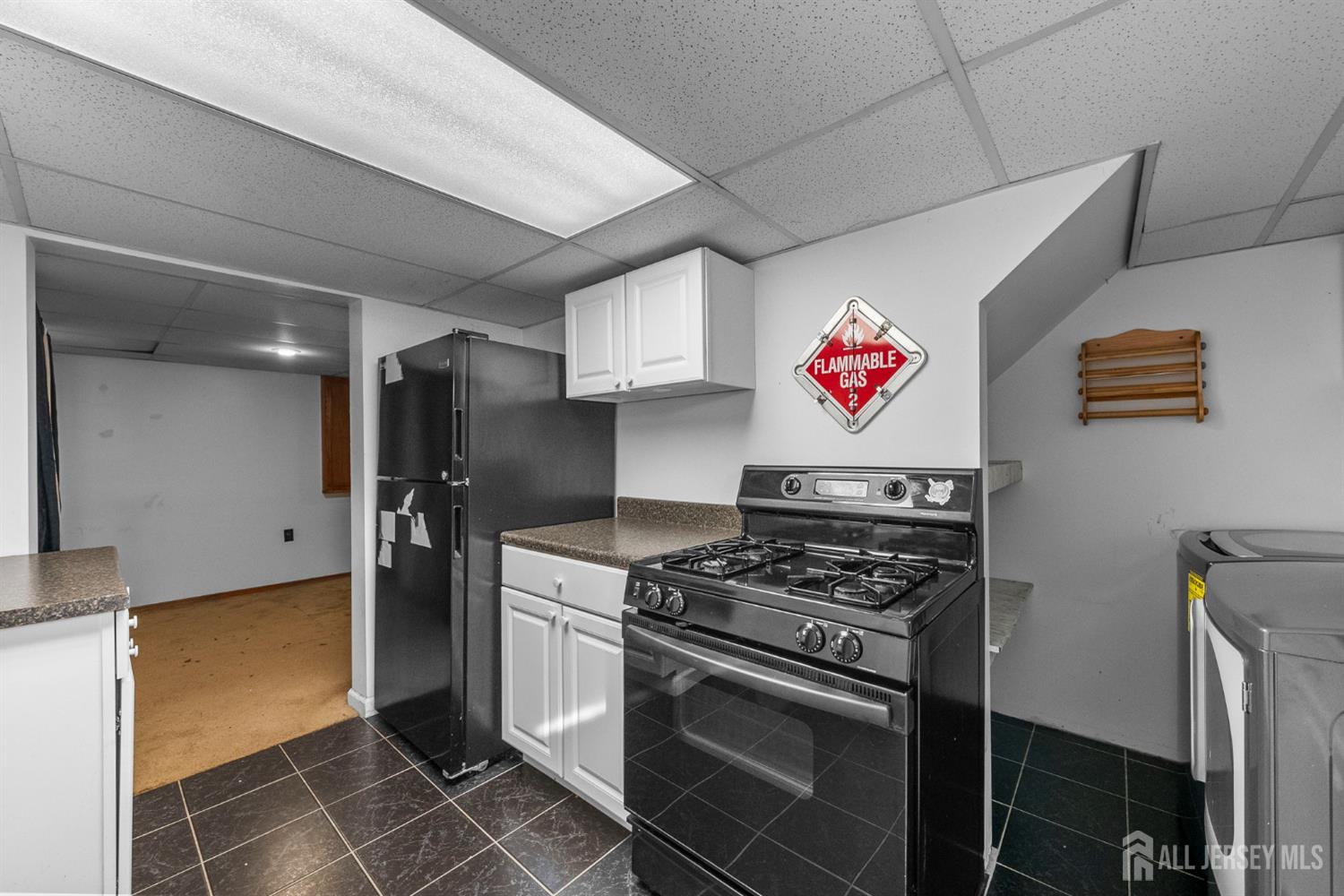 926 Hermann Road North Brunswick, NJ 08902 - Photo 34 of 54 a kitchen with stainless steel appliances granite countertop a stove a sink and a refrigerator