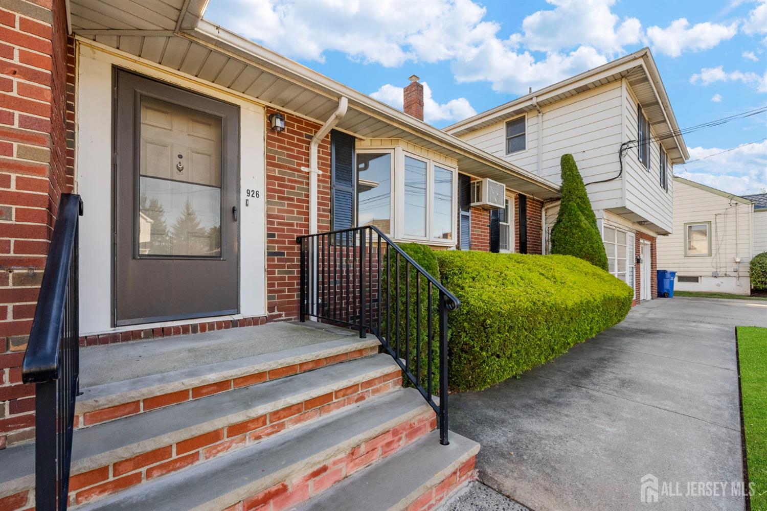 926 Hermann Road North Brunswick, NJ 08902 - Photo 4 of 54 a front view of a house with a garden