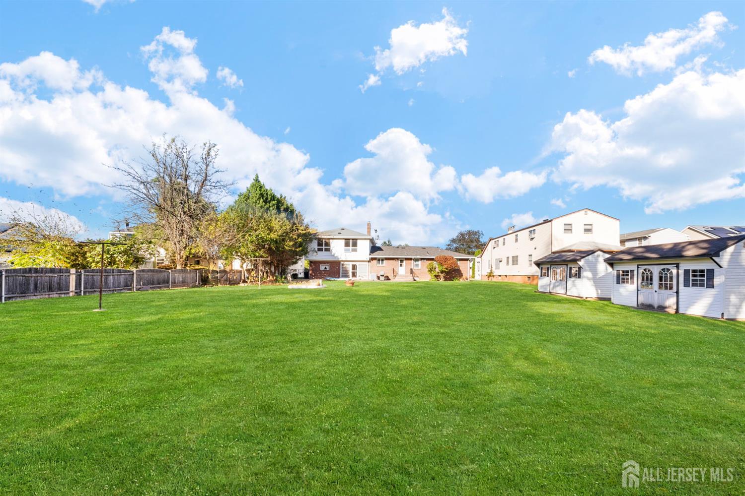 926 Hermann Road North Brunswick, NJ 08902 - Photo 48 of 54 a view of a big yard with table and chairs
