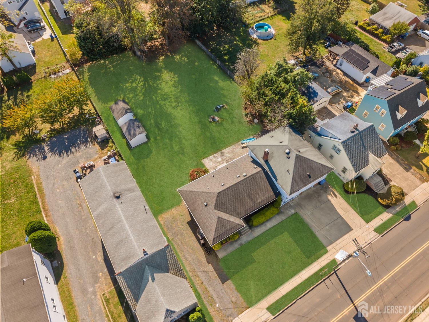 926 Hermann Road North Brunswick, NJ 08902 - Photo 49 of 54 an aerial view of a house with a garden and swimming pool