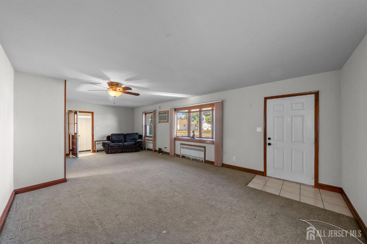 926 Hermann Road North Brunswick, NJ 08902 - Photo 6 of 54 a view of a livingroom with a furniture and window