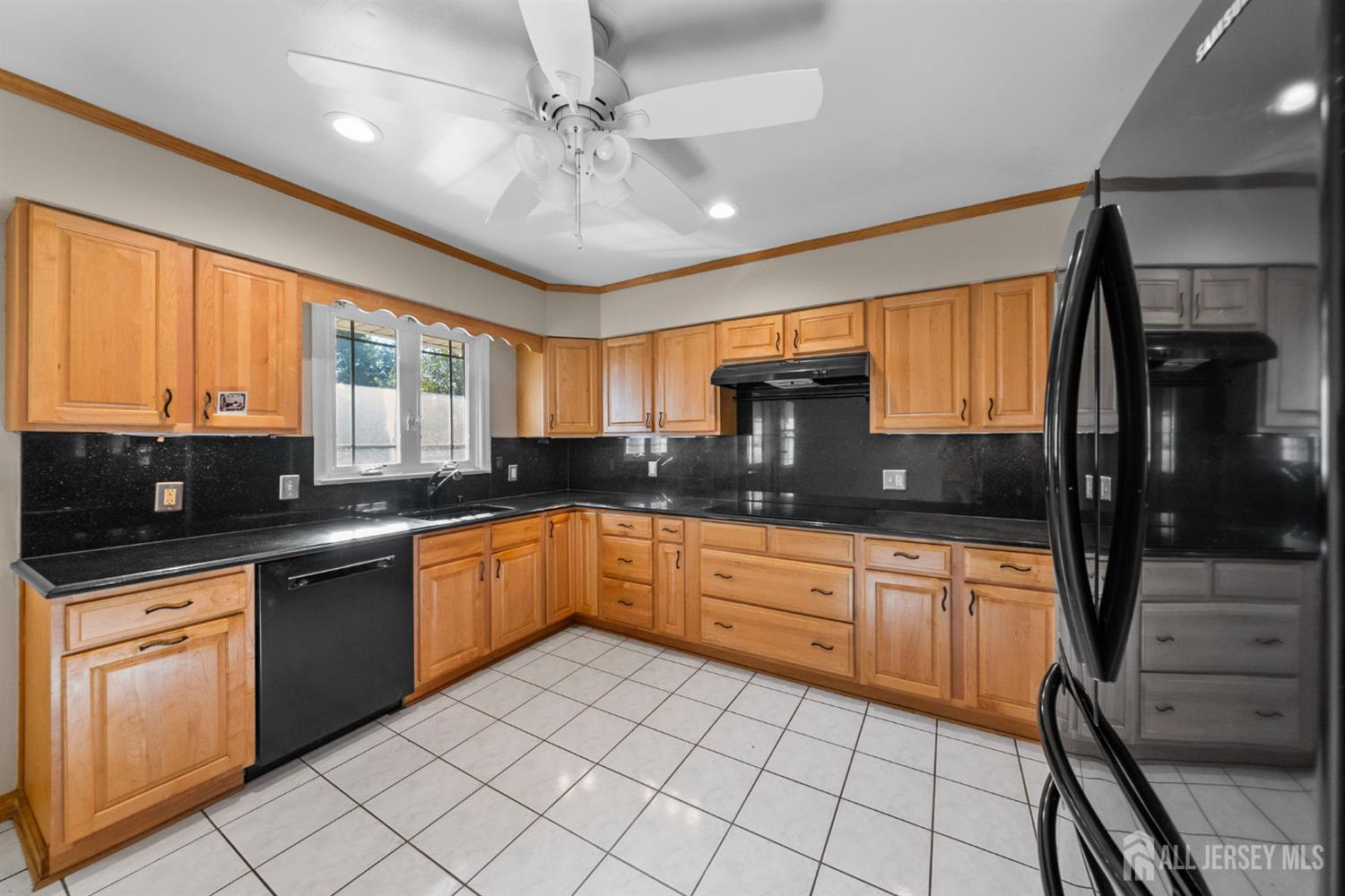 926 Hermann Road North Brunswick, NJ 08902 - Photo 9 of 54 a kitchen with stainless steel appliances granite countertop a sink and cabinets