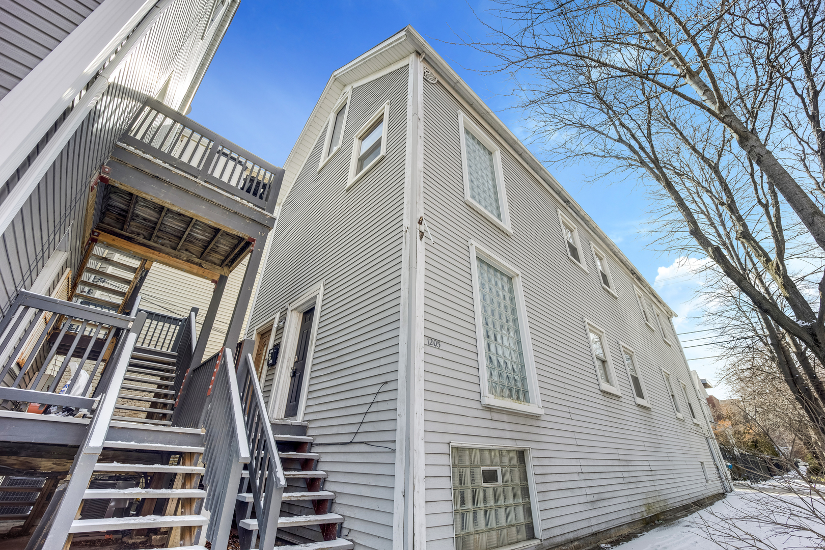 a view of a house with stairs and wooden floor