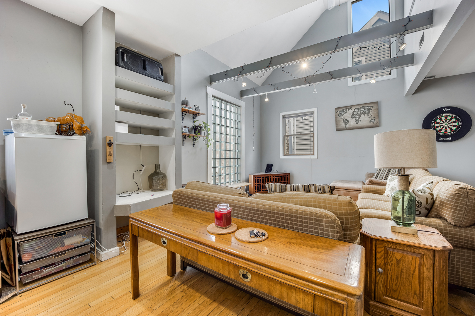 Undisclosed Address Chicago, IL 60657 - Photo 3 of 10 a bedroom with bed and a table with wooden floor