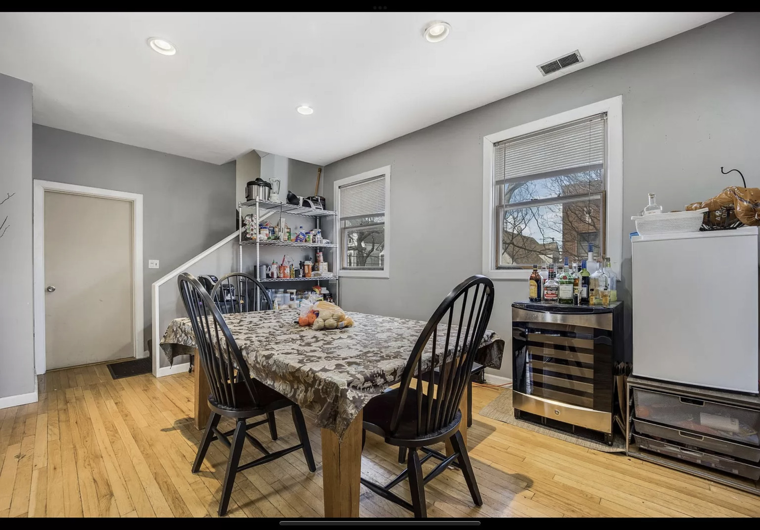 Undisclosed Address Chicago, IL 60657 - Photo 4 of 10 a view of a dining room with furniture and wooden floor