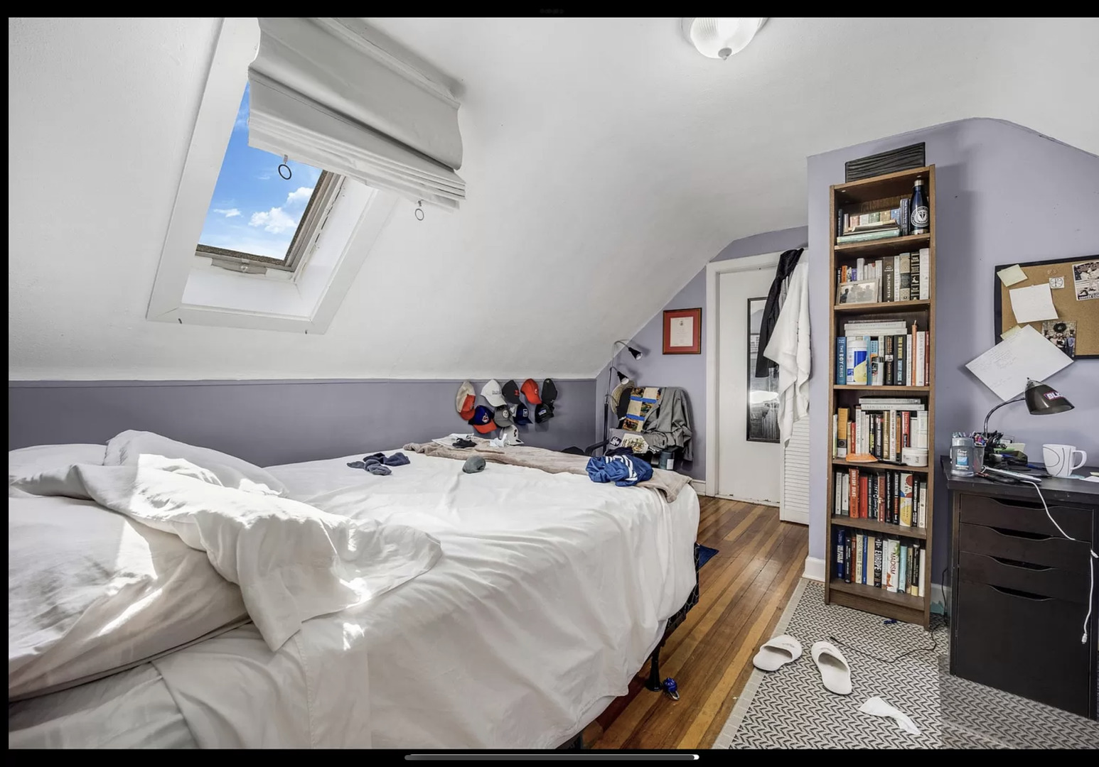 Undisclosed Address Chicago, IL 60657 - Photo 5 of 10 a bedroom with a bed and a book shelf