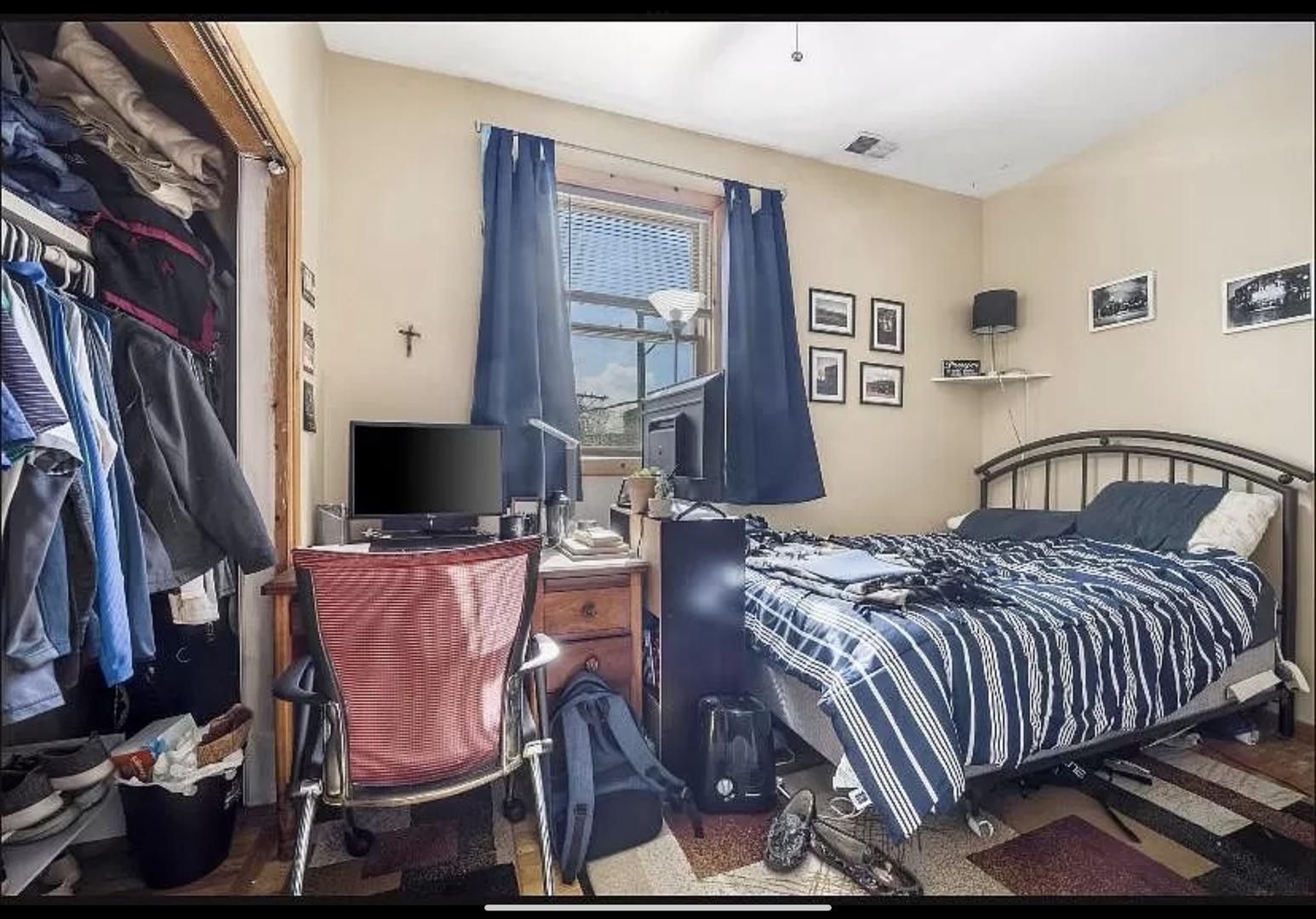 Undisclosed Address Chicago, IL 60657 - Photo 8 of 10 a bedroom with a bed and flat screen tv