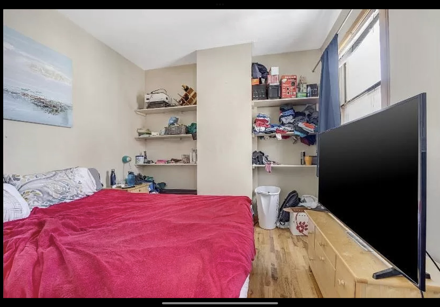 Undisclosed Address Chicago, IL 60657 - Photo 9 of 10 a bed room with a bed and a window