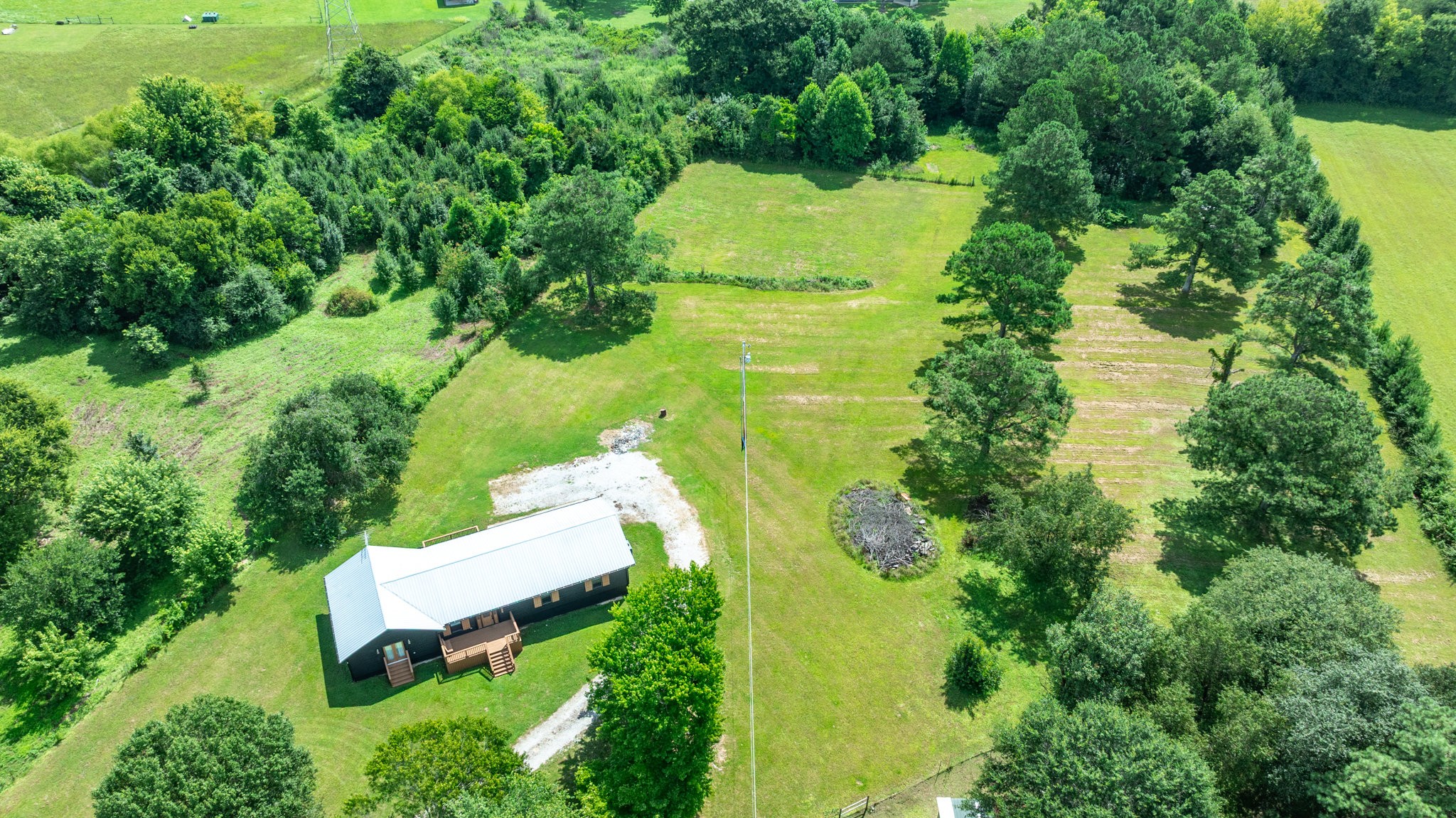 340 Old Spring Creek Road Estill Springs, TN 37330 - Photo 40 of 60 an aerial view of residential house with outdoor space and trees all around