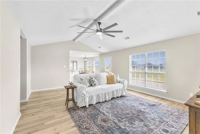 a living room with furniture and a window