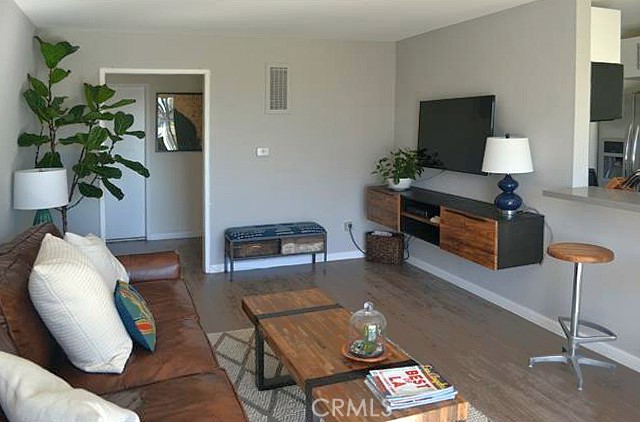3111 4th Street, Unit 218 Santa Monica, CA 90405 - Photo 4 of 11 a living room with furniture and a lamp