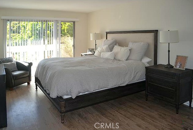 3111 4th Street, Unit 218 Santa Monica, CA 90405 - Photo 8 of 11 a large bed sitting in a bedroom next to a window