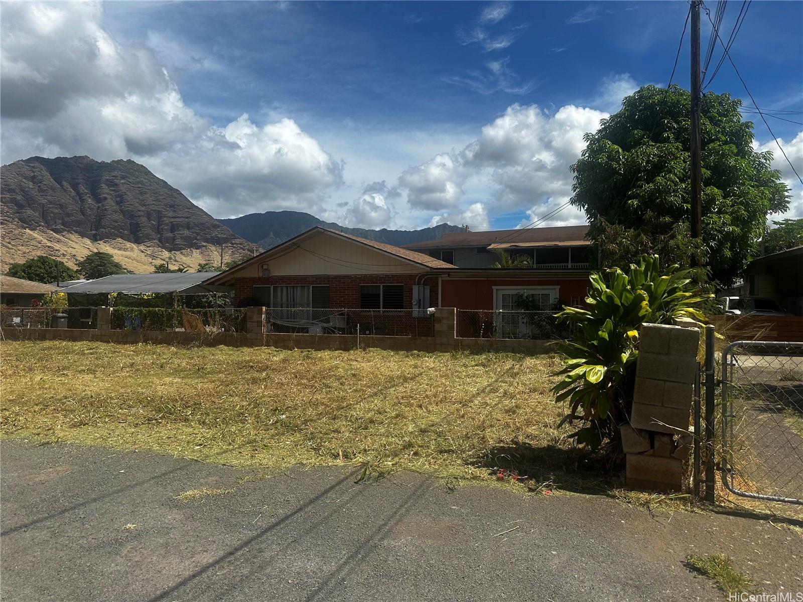 85-832 Old Government Road Waianae, HI 96792 - Photo 3 of 5 a front view of a house with a garden