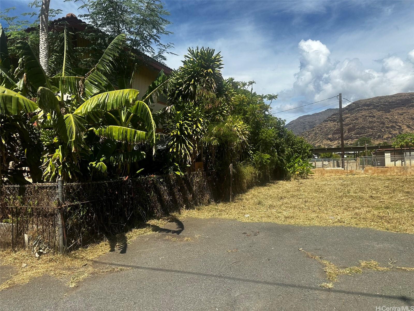 85-832 Old Government Road Waianae, HI 96792 - Photo 4 of 5 a view of a street with flower plants
