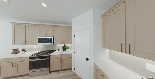 a kitchen with a sink and a stove top oven