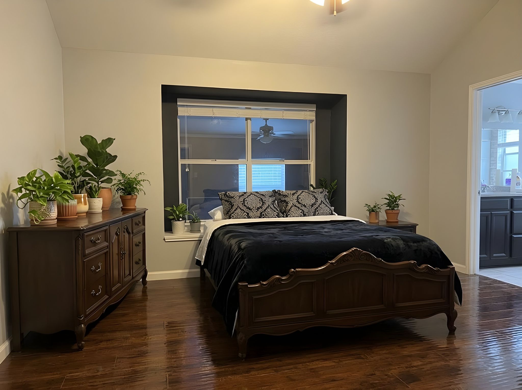 5611 Meadow Crest Austin, TX 78744 - Photo 15 of 29 Virtual Staged, Rich hardwood flooring creates a welcoming ambiance in this well-appointed sleeping sanctuary.