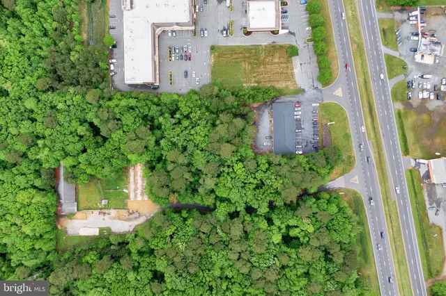 an aerial view of a house with a garden