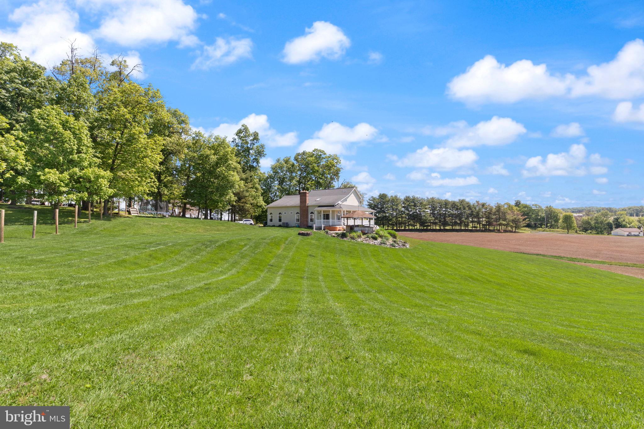 2140 Marston Road New Windsor, MD 21776 - Photo 42 of 48 a view of a golf course with a lake