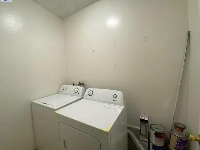 a kitchen with a refrigerator and a sink