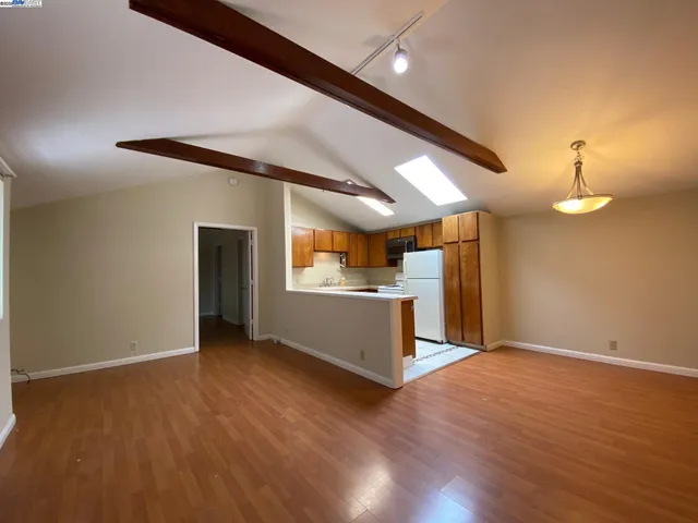 a kitchen with a sink a stove and refrigerator