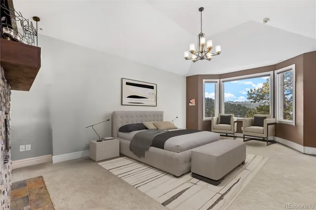 a living room with furniture a chandelier and a flat screen tv