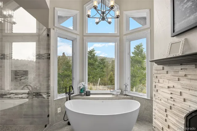 a spacious bathroom with a bathtub and windows