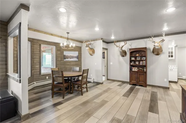 a view of a dining room with furniture window and wooden floor