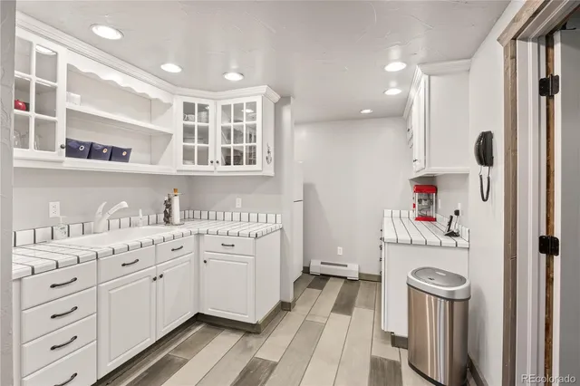 a bathroom with a sink a washer and dryer