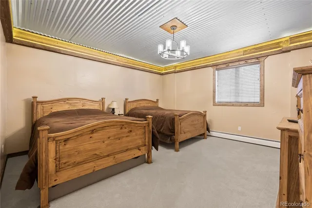 a bedroom with bed and a window