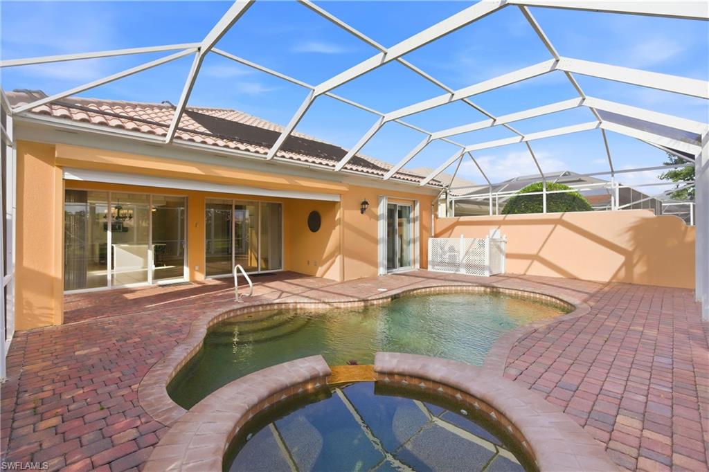 7704 Hernando Court Naples, FL 34114 - Photo 36 of 41 a view of a swimming pool with a patio