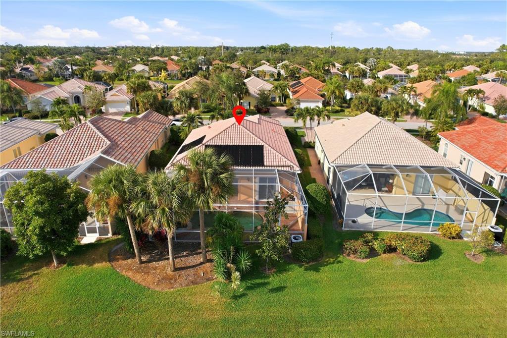 7704 Hernando Court Naples, FL 34114 - Photo 39 of 41 an aerial view of residential houses with outdoor space and trees