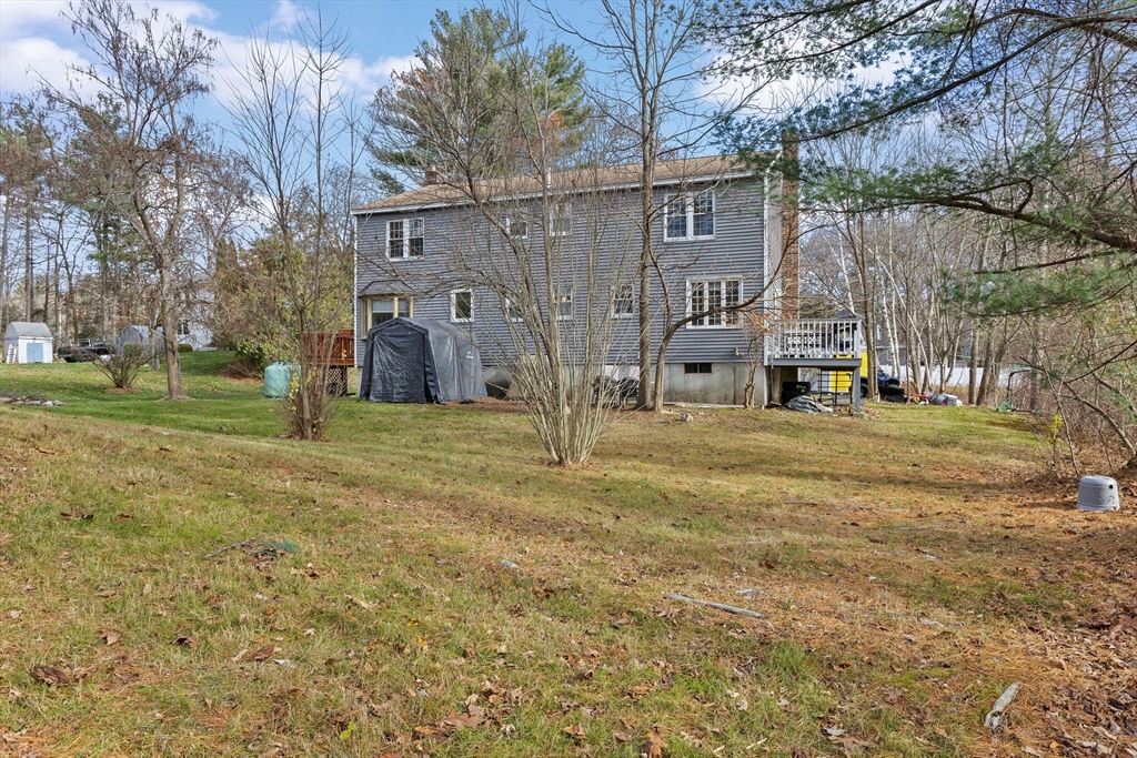 5 A Homestead Drive, Unit A Derry, NH 03038 - Photo 24 of 26 a view of a house with a yard