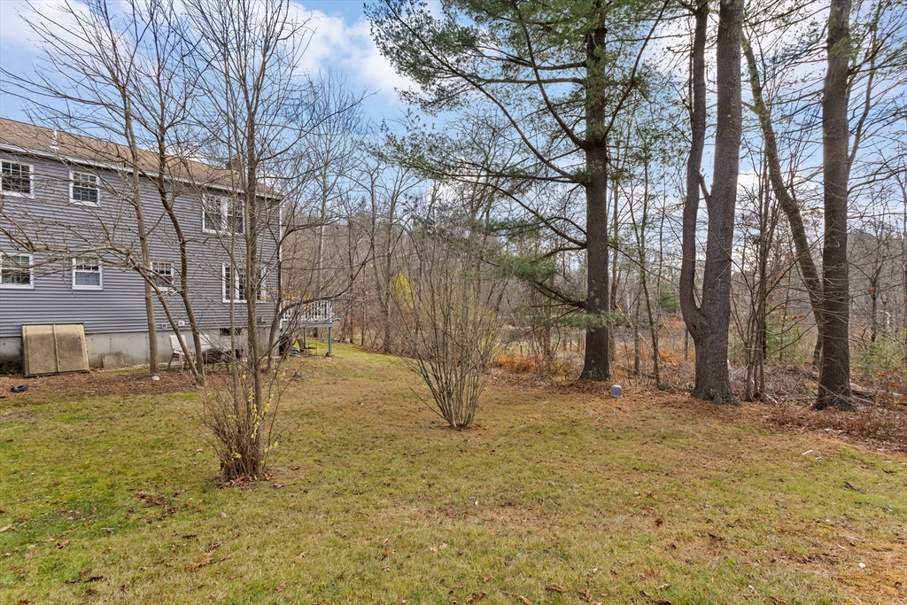 5 A Homestead Drive, Unit A Derry, NH 03038 - Photo 25 of 26 a view of yard with trees