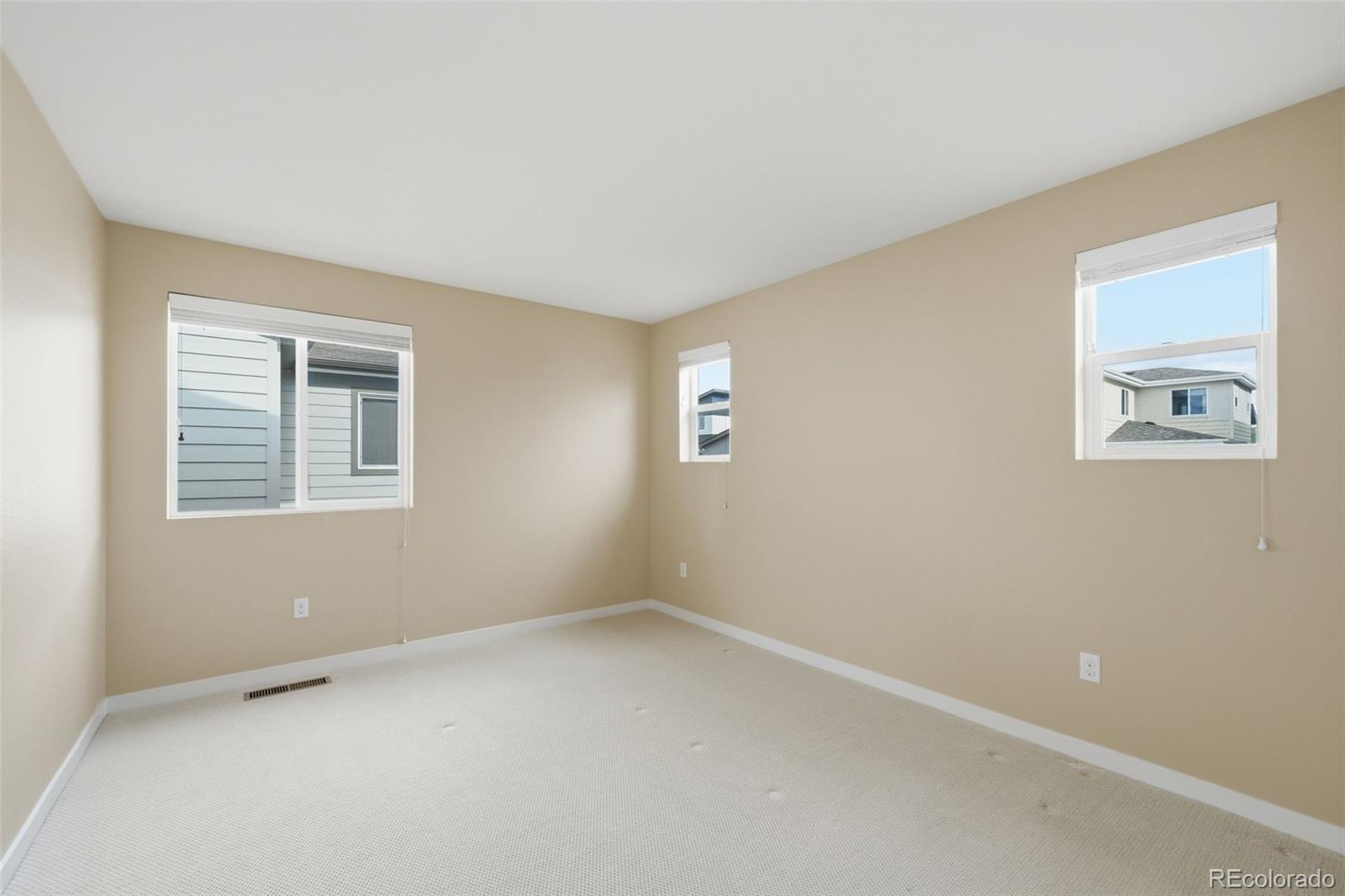 9602 Dunning Circle Highlands Ranch, CO 80126 - Photo 38 of 50 an empty room with windows