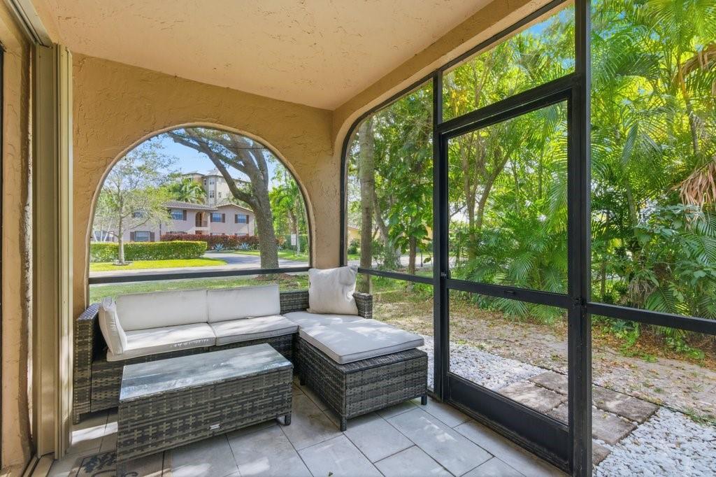 10900 West Sample Road Coral Springs, FL 33065 - Photo 28 of 32 a view of a floor to ceiling window in a yard