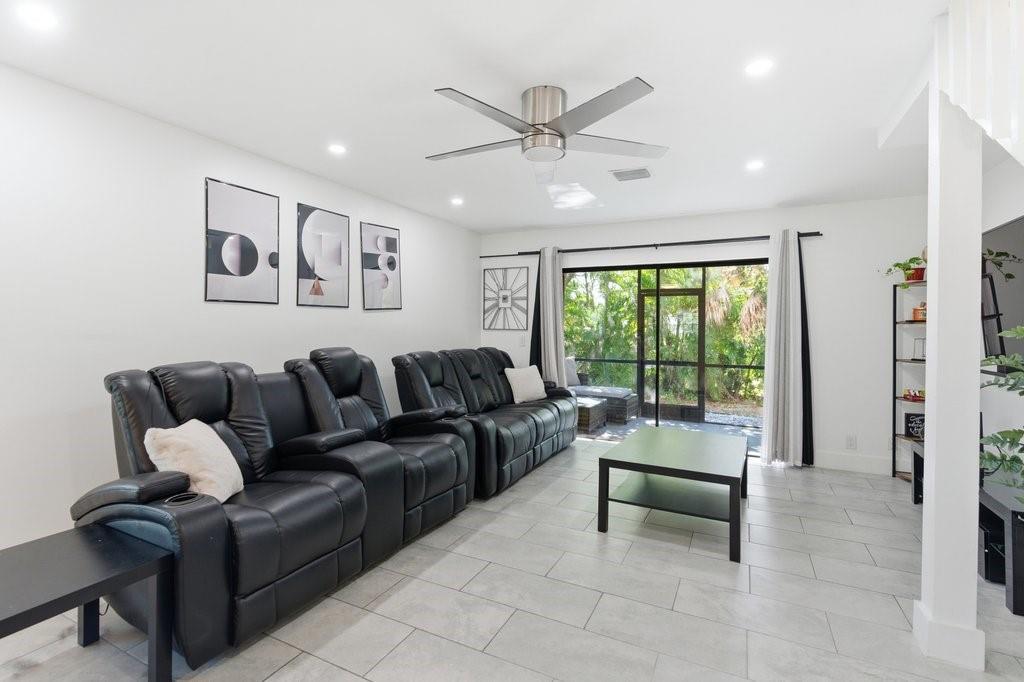 10900 West Sample Road Coral Springs, FL 33065 - Photo 9 of 32 a living room with furniture and a large window