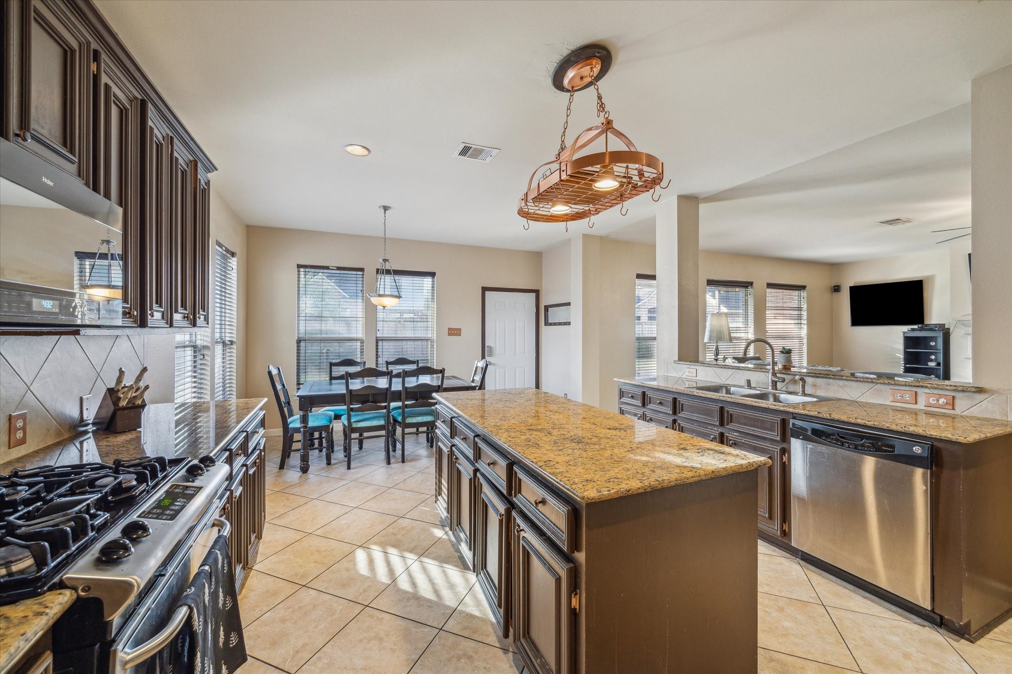 15907 Chart House Court Houston, TX 77044 - Photo 11 of 28 a kitchen with a table and chairs in it