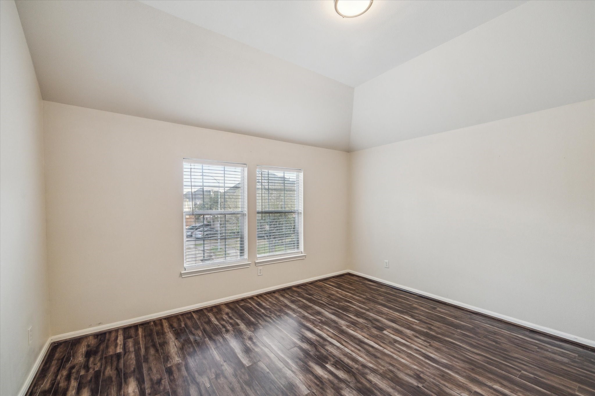 15907 Chart House Court Houston, TX 77044 - Photo 18 of 28 an empty room with wooden floor and windows