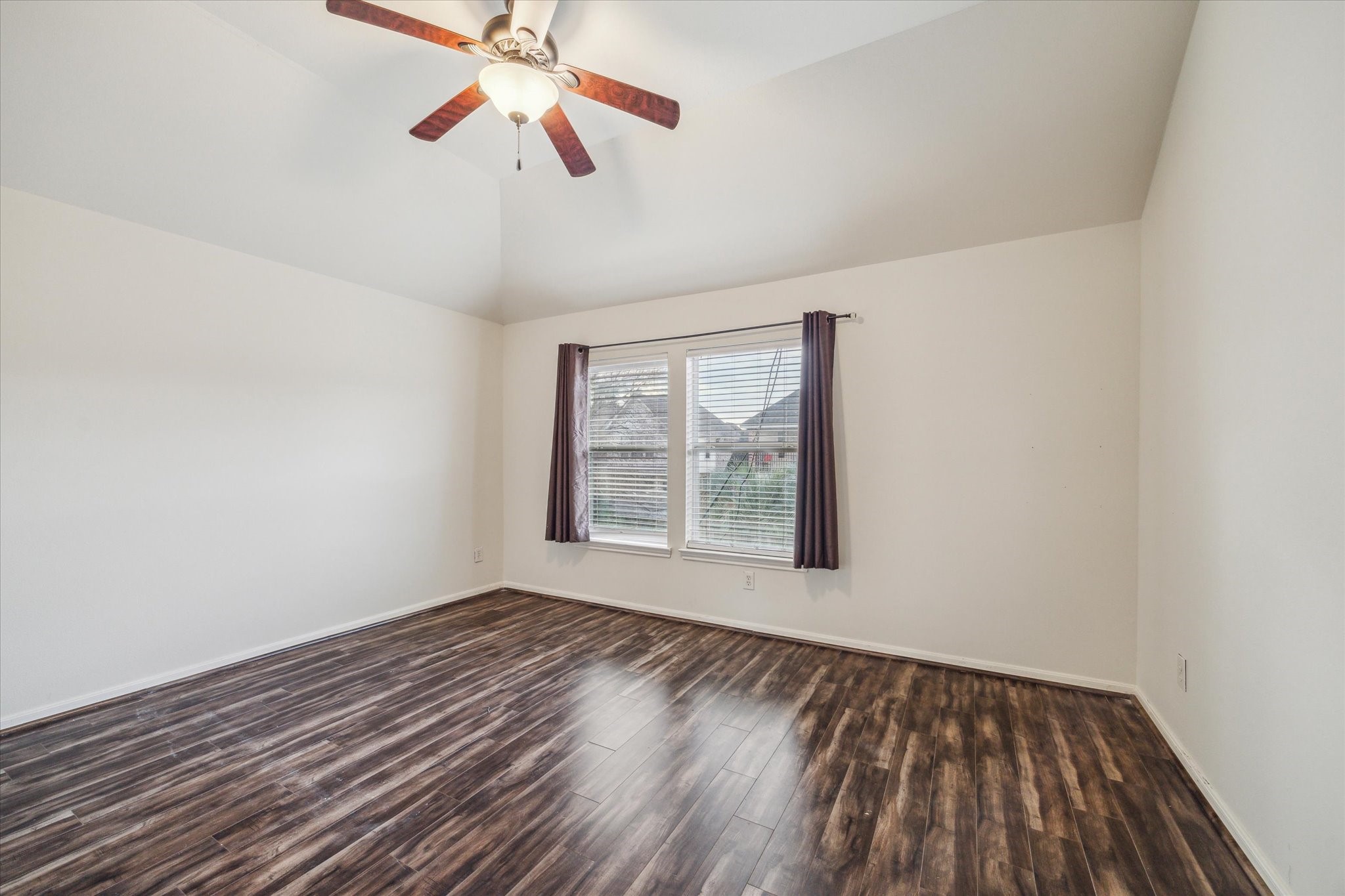 15907 Chart House Court Houston, TX 77044 - Photo 19 of 28 a view of an empty room with wooden floor and a window